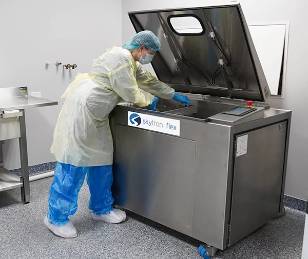 Skytron Flex Ultrasonic Washer Disinfector being used by medical personnel in scrubs